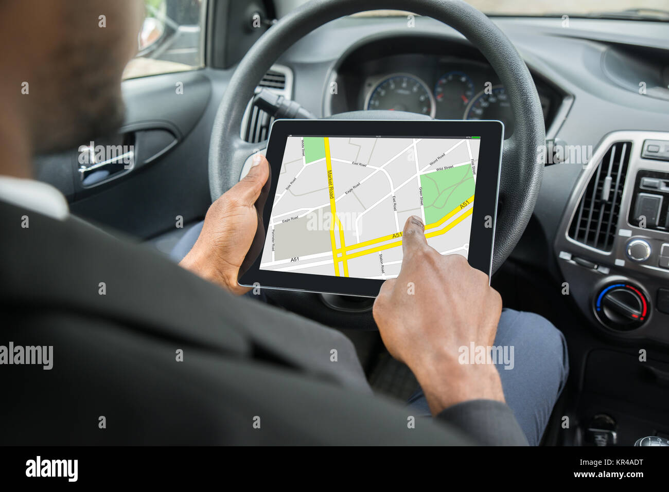Businessman Using GPS Navigation System On Digital Tablet Stock Photo ...
