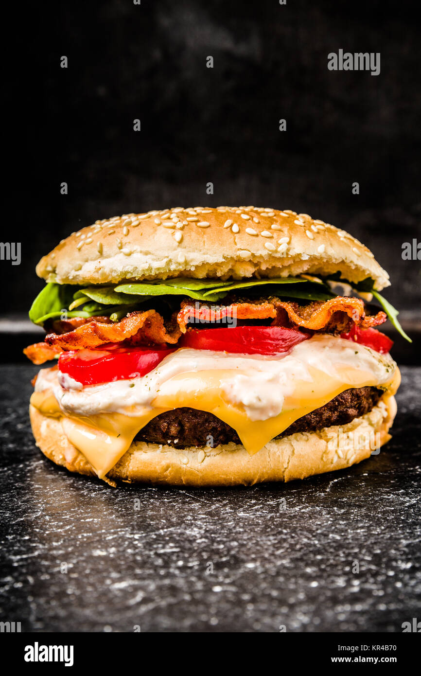 burger with fried bacon Stock Photo - Alamy