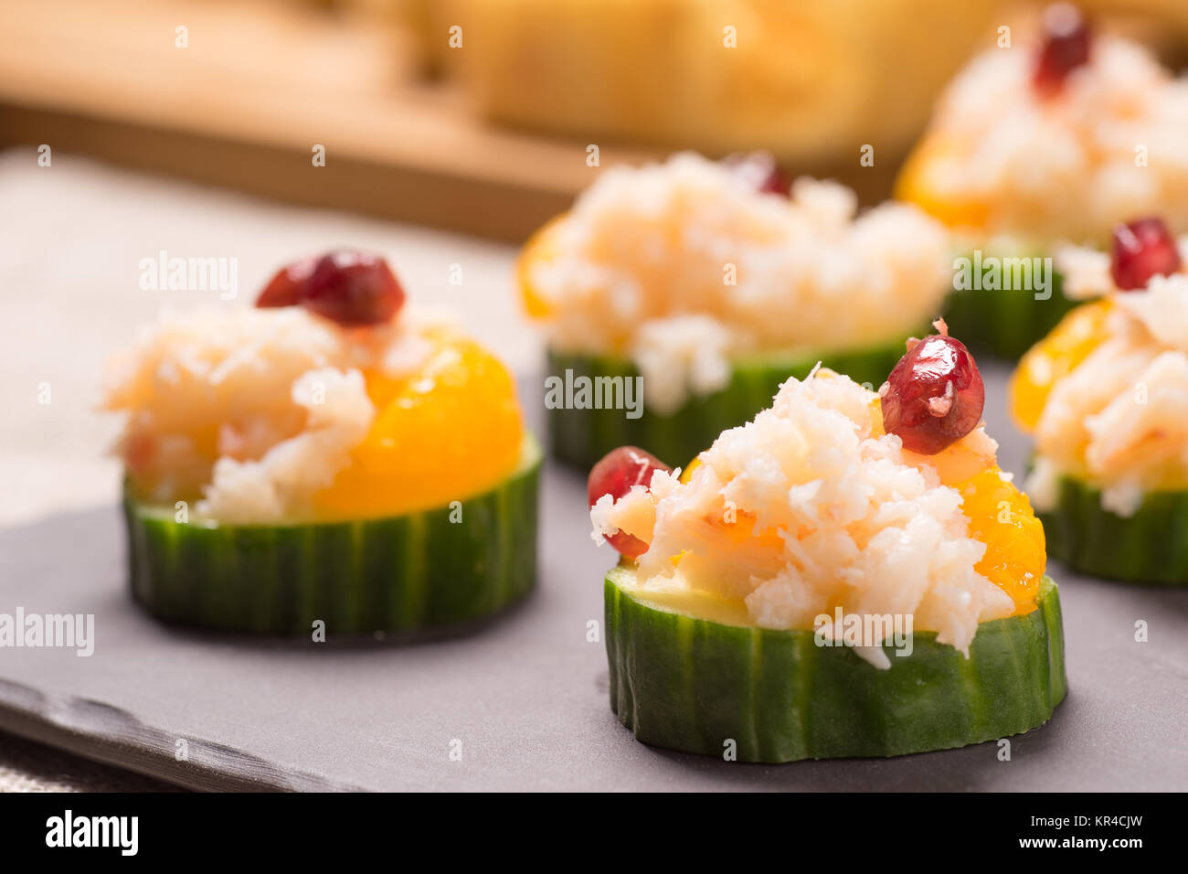 Crab meat appetizer served on Cucumber slices Stock Photo Alamy