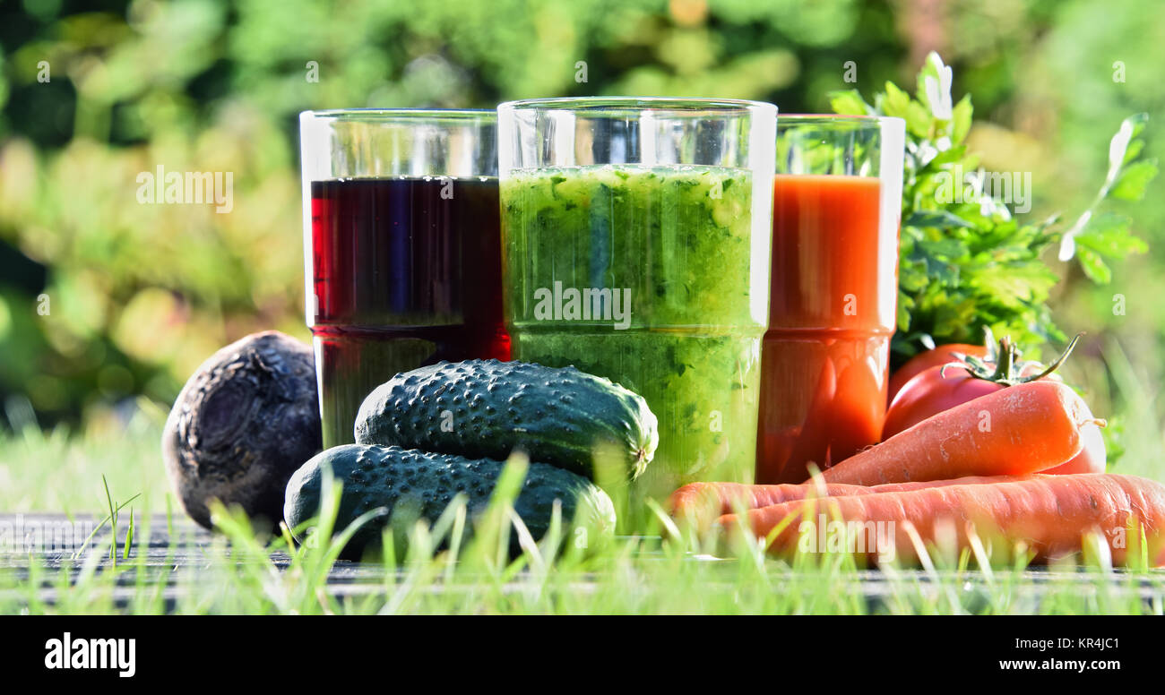 Glasses with fresh organic detox juices in the garden Stock Photo Alamy