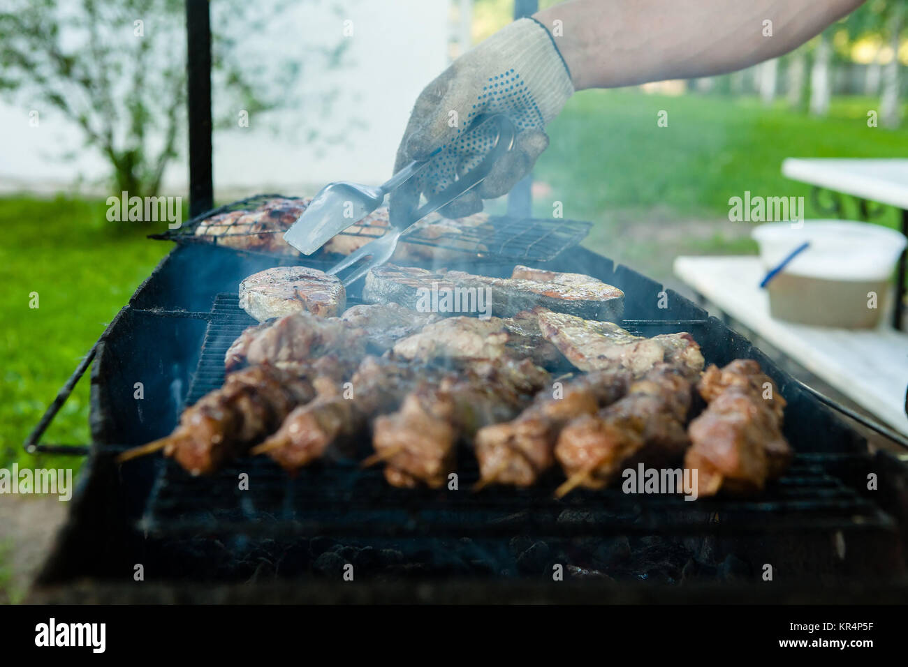 chef grilling lamb ribs on flame Stock Photo - Alamy