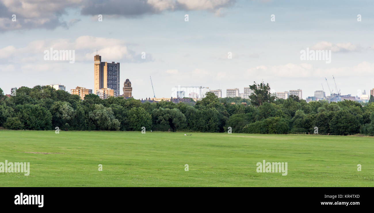 London, England - July 10, 2016: The brutalist Trellick Tower high-rise council housing block and the skyline of North Kensington seen from Wormwood S Stock Photo