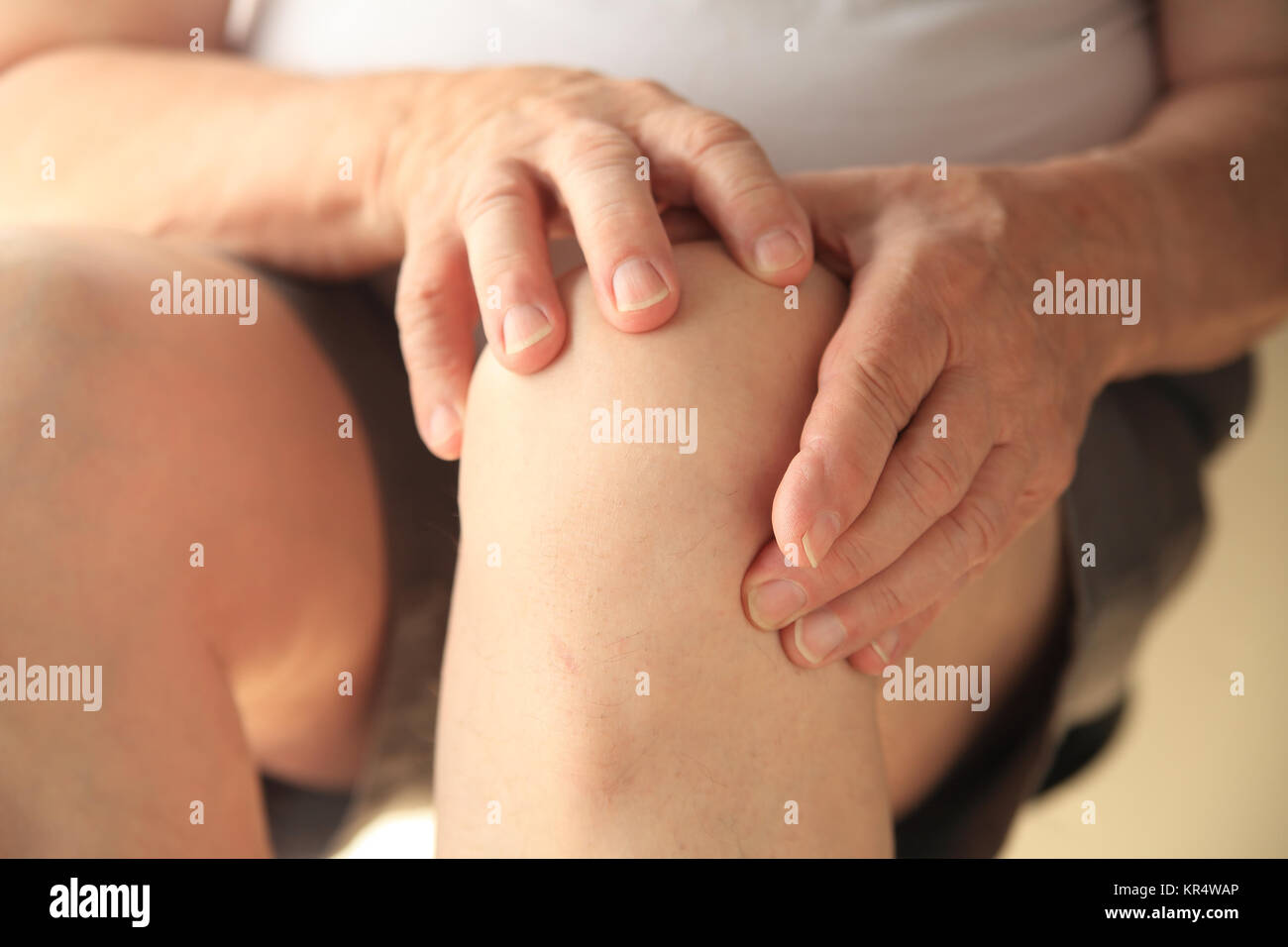 Older man hands on knees hi-res stock photography and images - Alamy