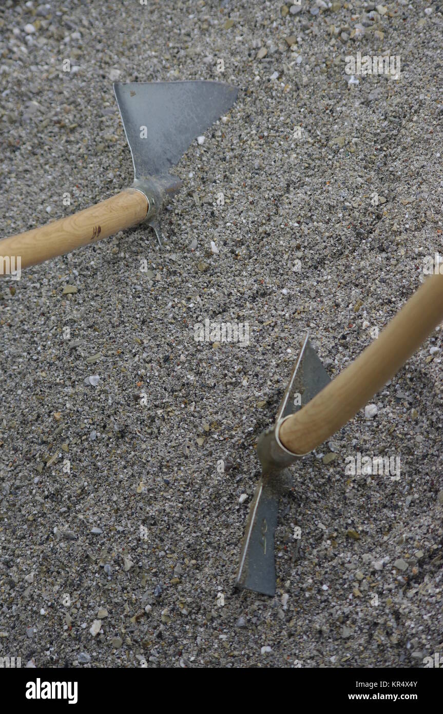 shovels in the sand Stock Photo