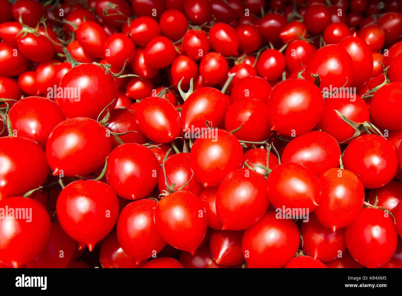 Top view of many cherry tomatoes at the market Stock Photo - Alamy