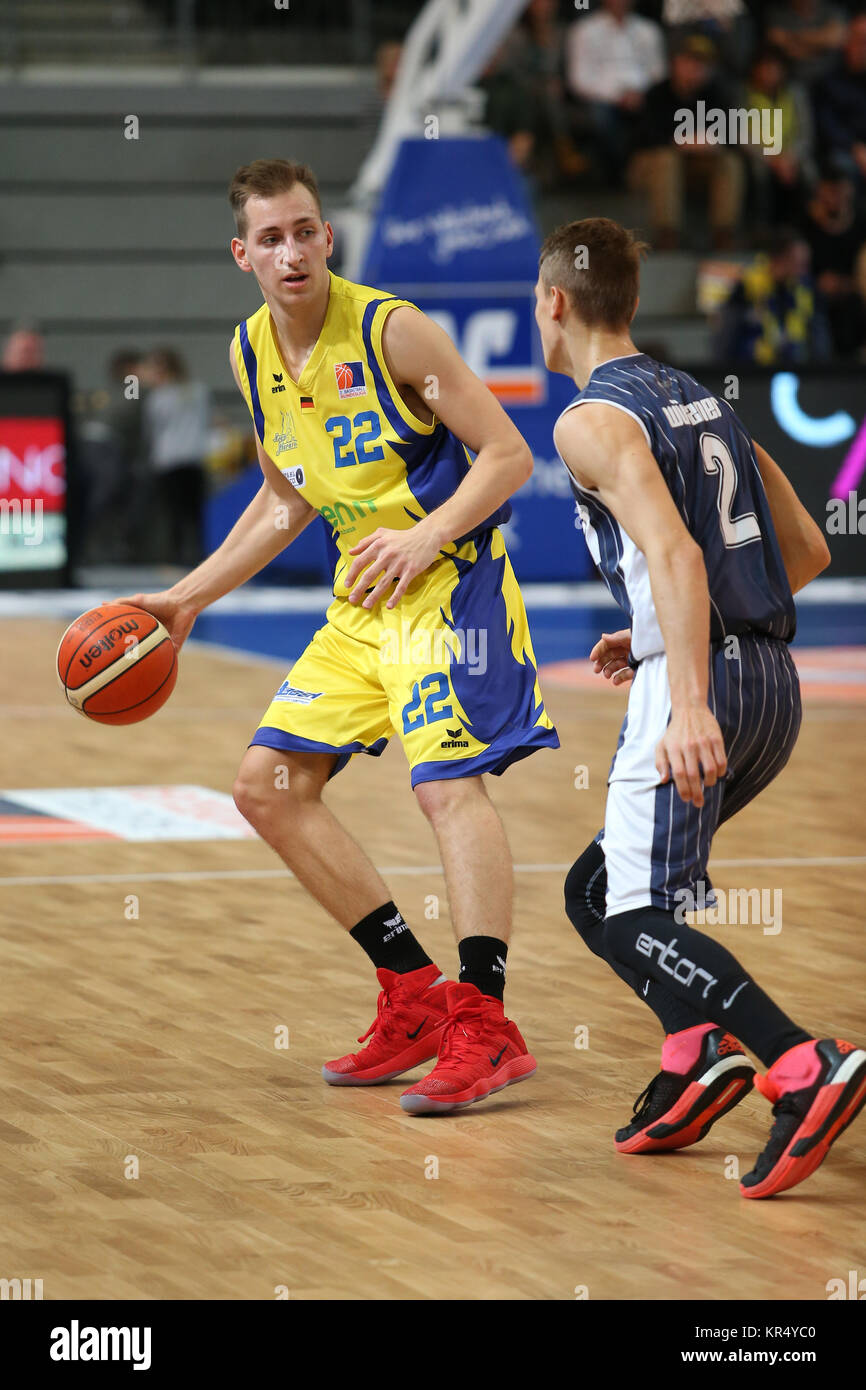 Hagen, Germany. 16th Dec, 2017. Jonas Grof #22 (Phoenix Hagen) and Niklas  Wuerzner #2 (MLP Academics Heidelberg) in action during the Hagen and MLP  Academics Heidelberg Basketball match where MLP won with