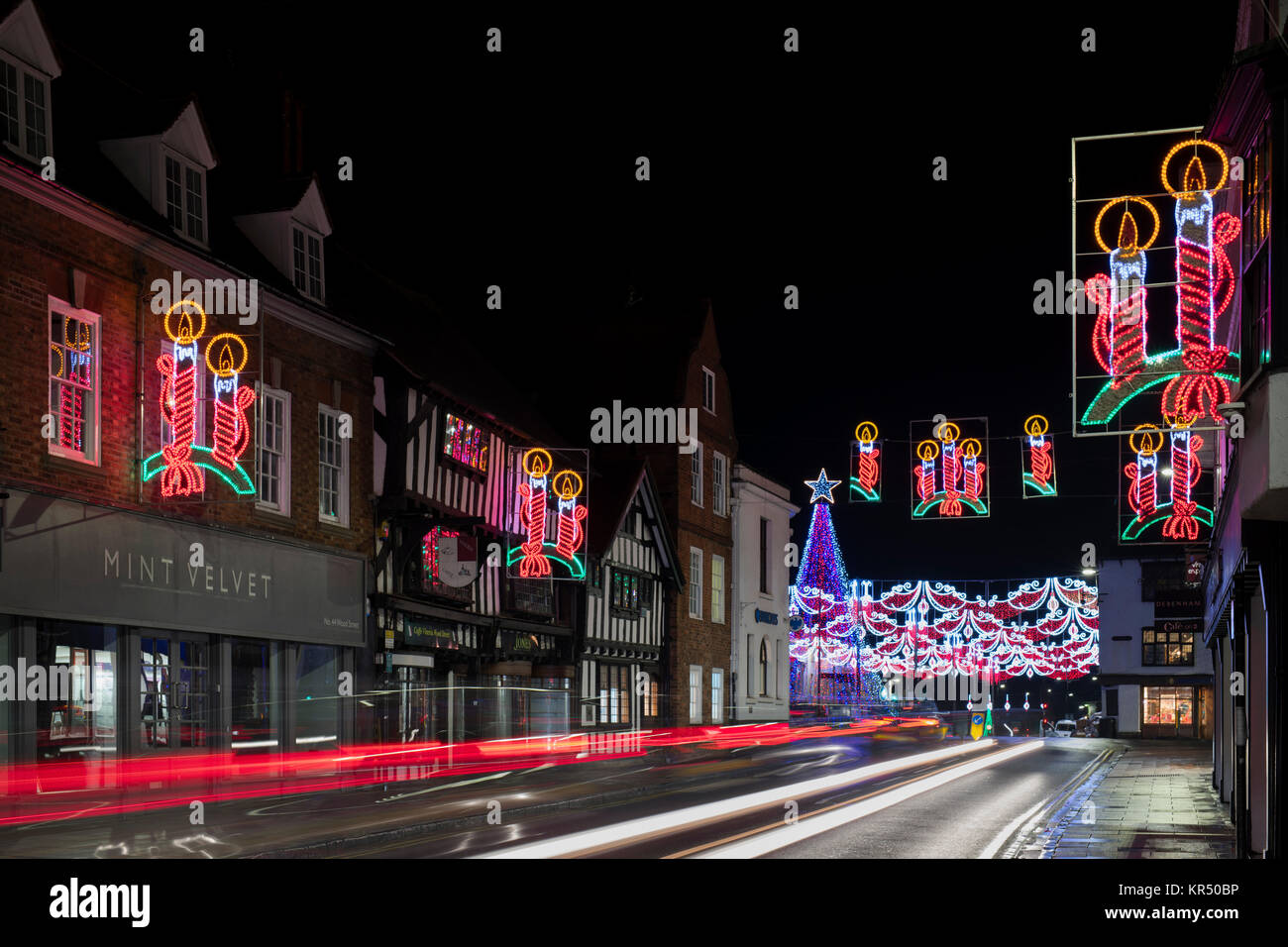 Christmas tree and candle light decorations at night in Stratford Upon