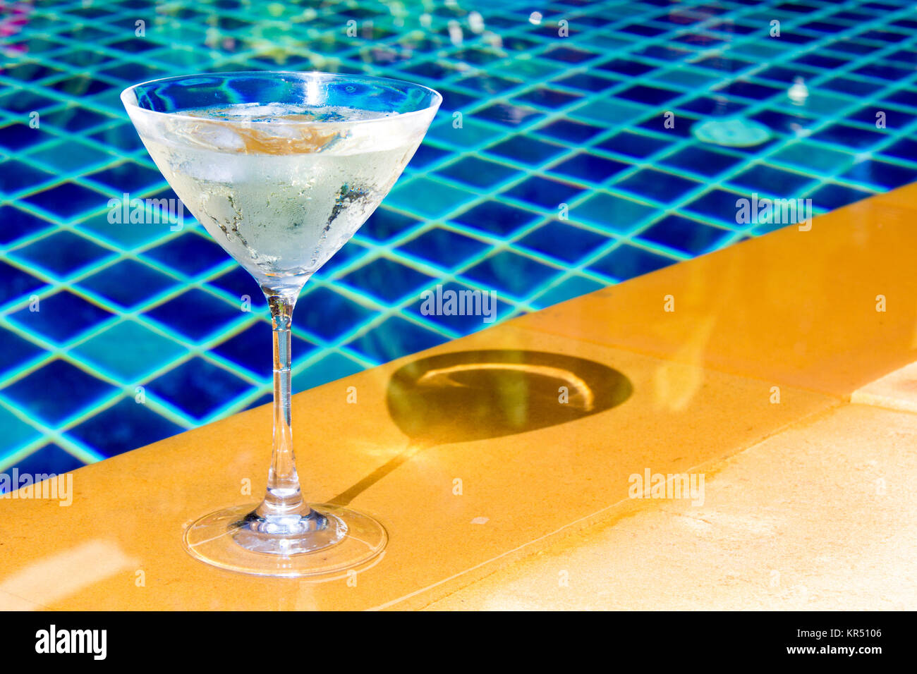 Cool cocktail standing by swimming pool Stock Photo
