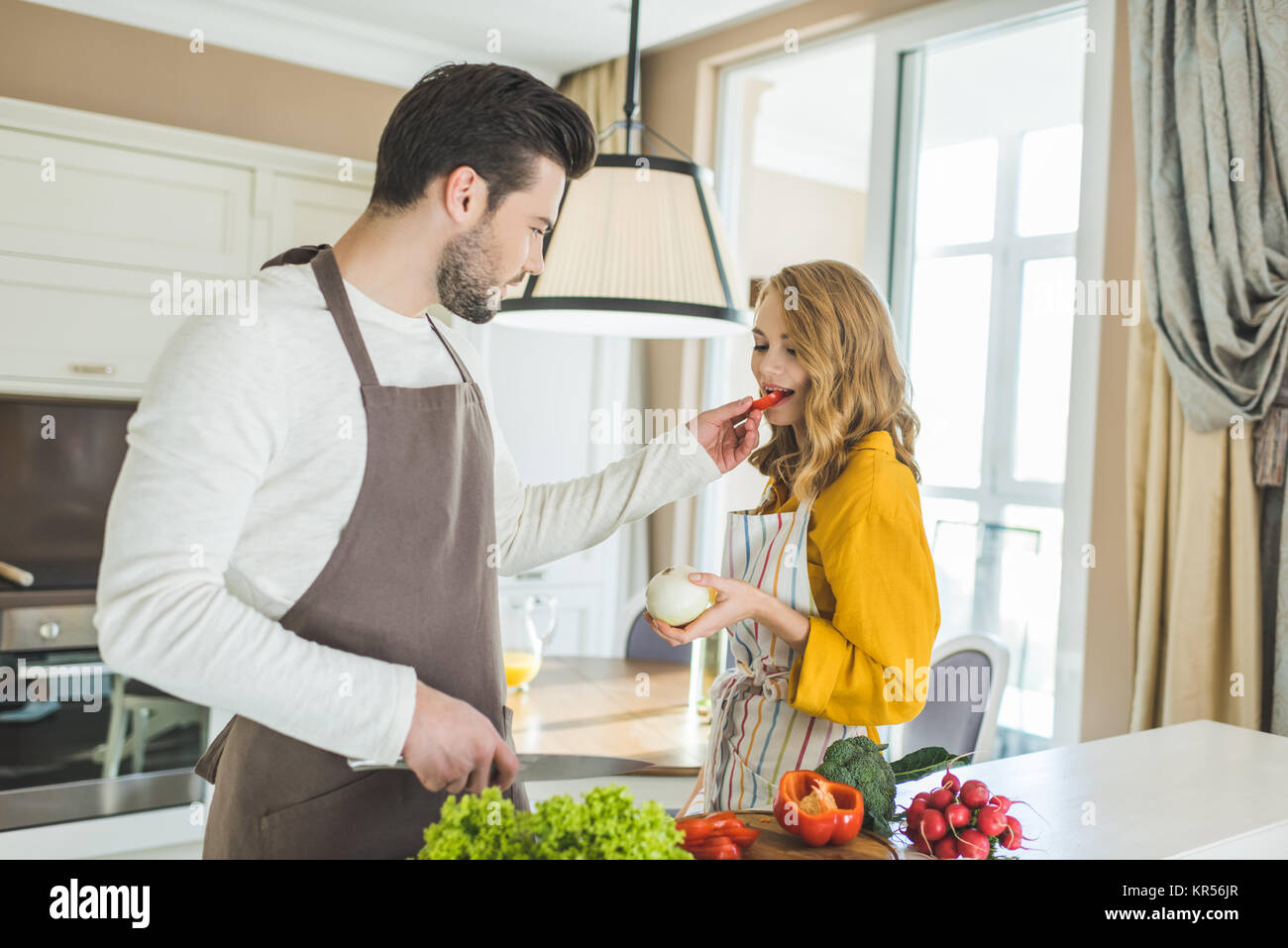 Couple preparing vegetables Stock Photo