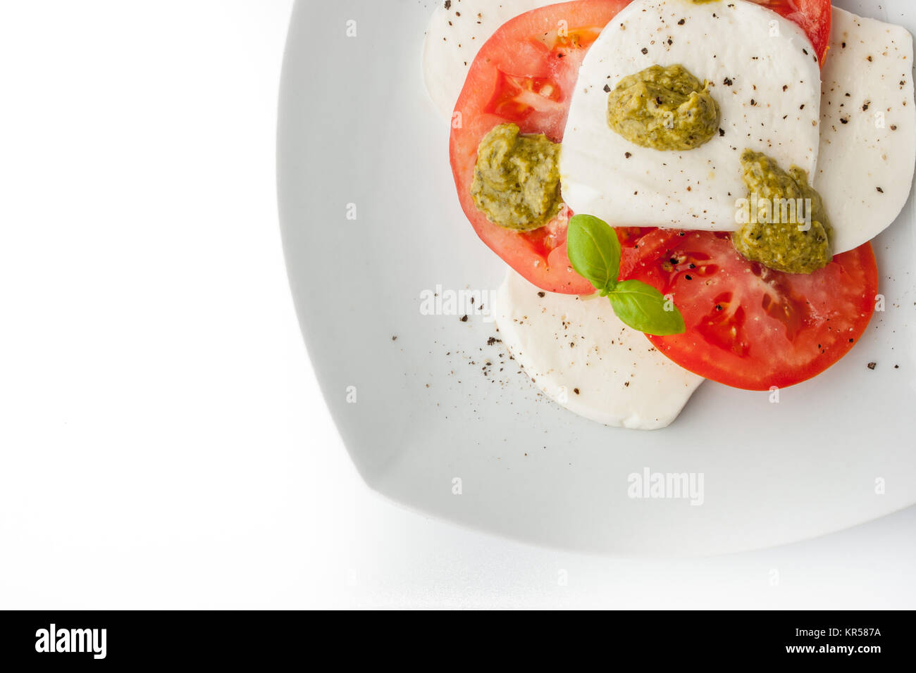 Caprese salad on the white square plate top view Stock Photo