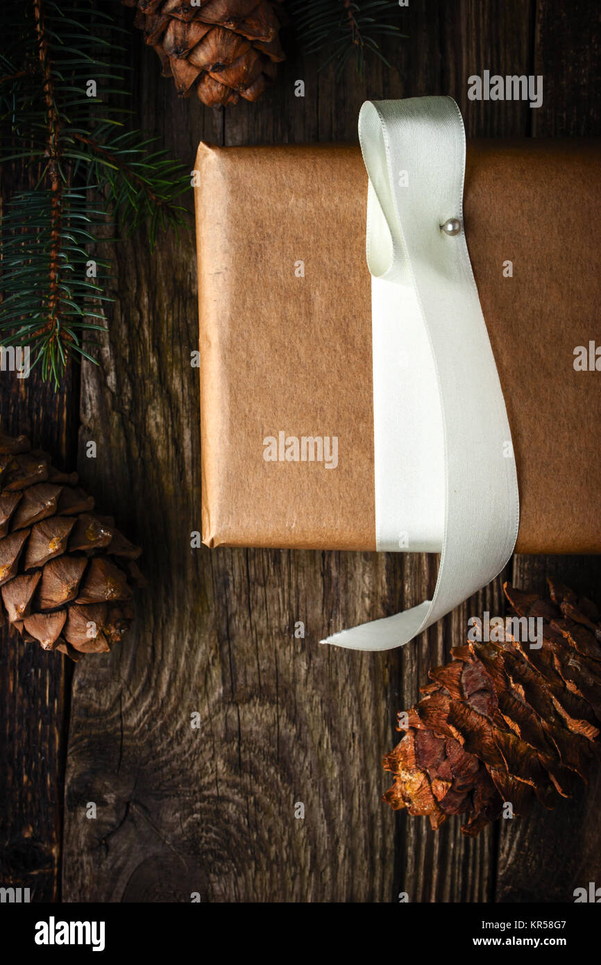 Homemade gift with fir tree and  cone vertical . Christmas theme Stock Photo