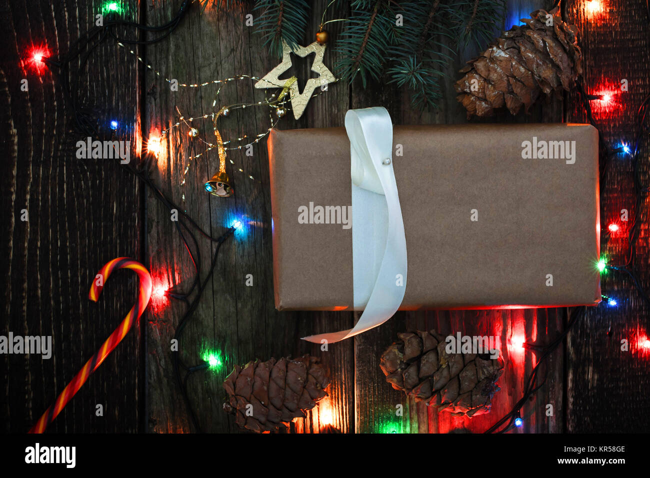 Homemade present with Christmas fir tree , candy and  cone Stock Photo