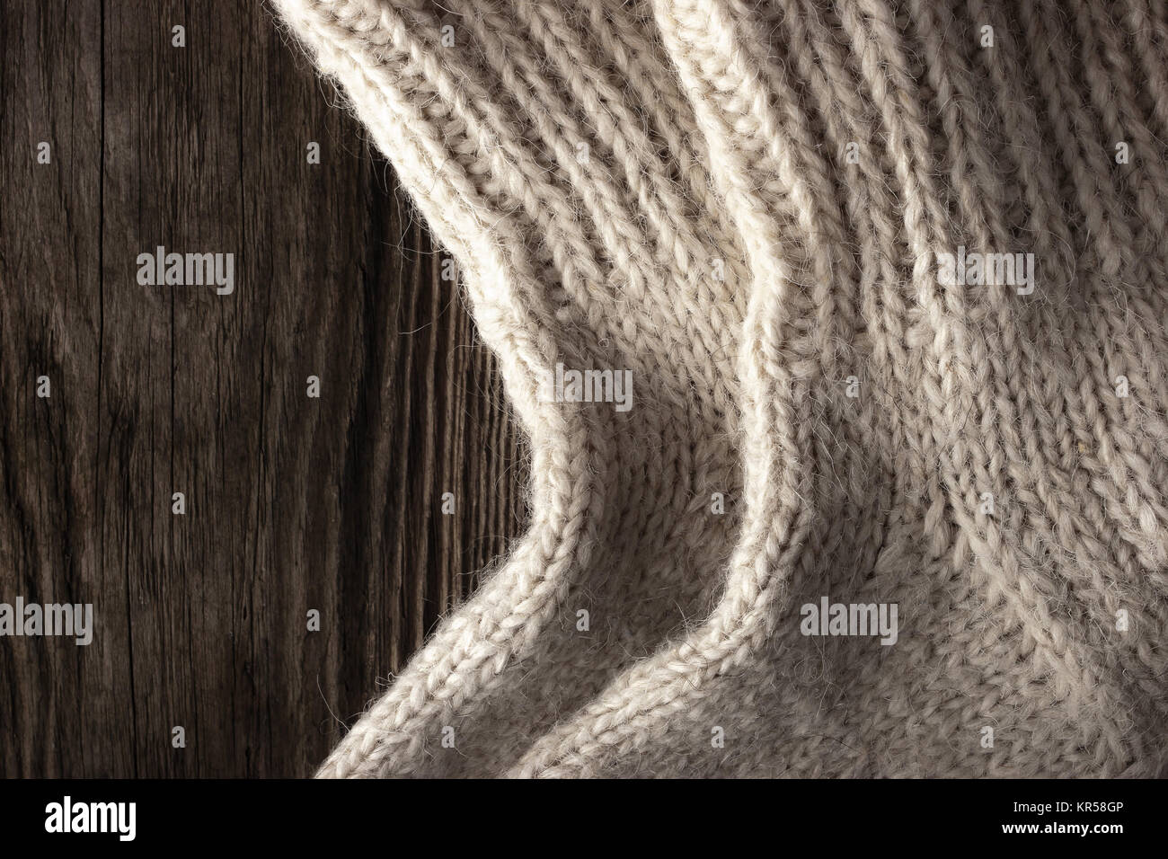 Knitted wool socks on the wooden background Stock Photo