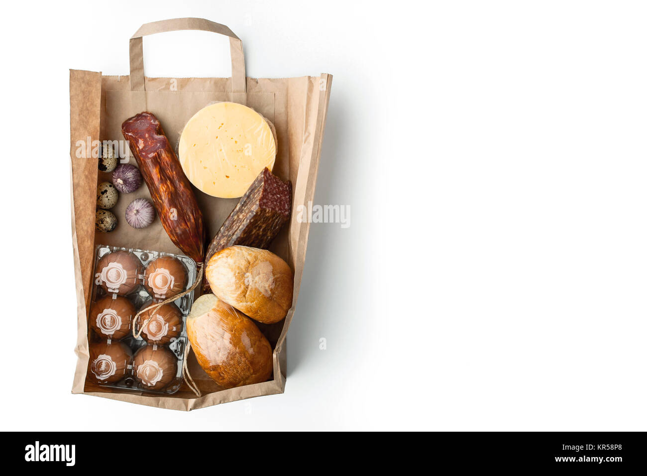 Food mix  inside a paper bag on the white background Stock Photo