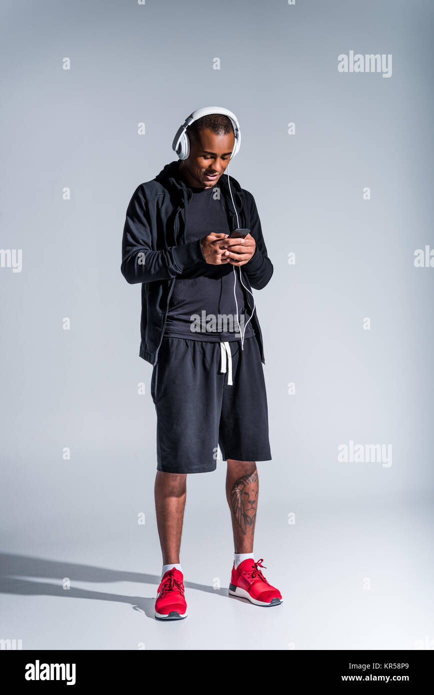 Smiling african american sportsman using hi-res stock photography and ...