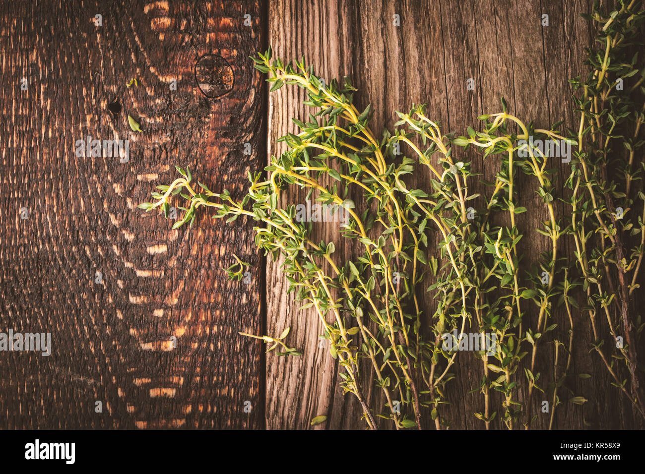 Thyme sprigs on the old wooden background Stock Photo