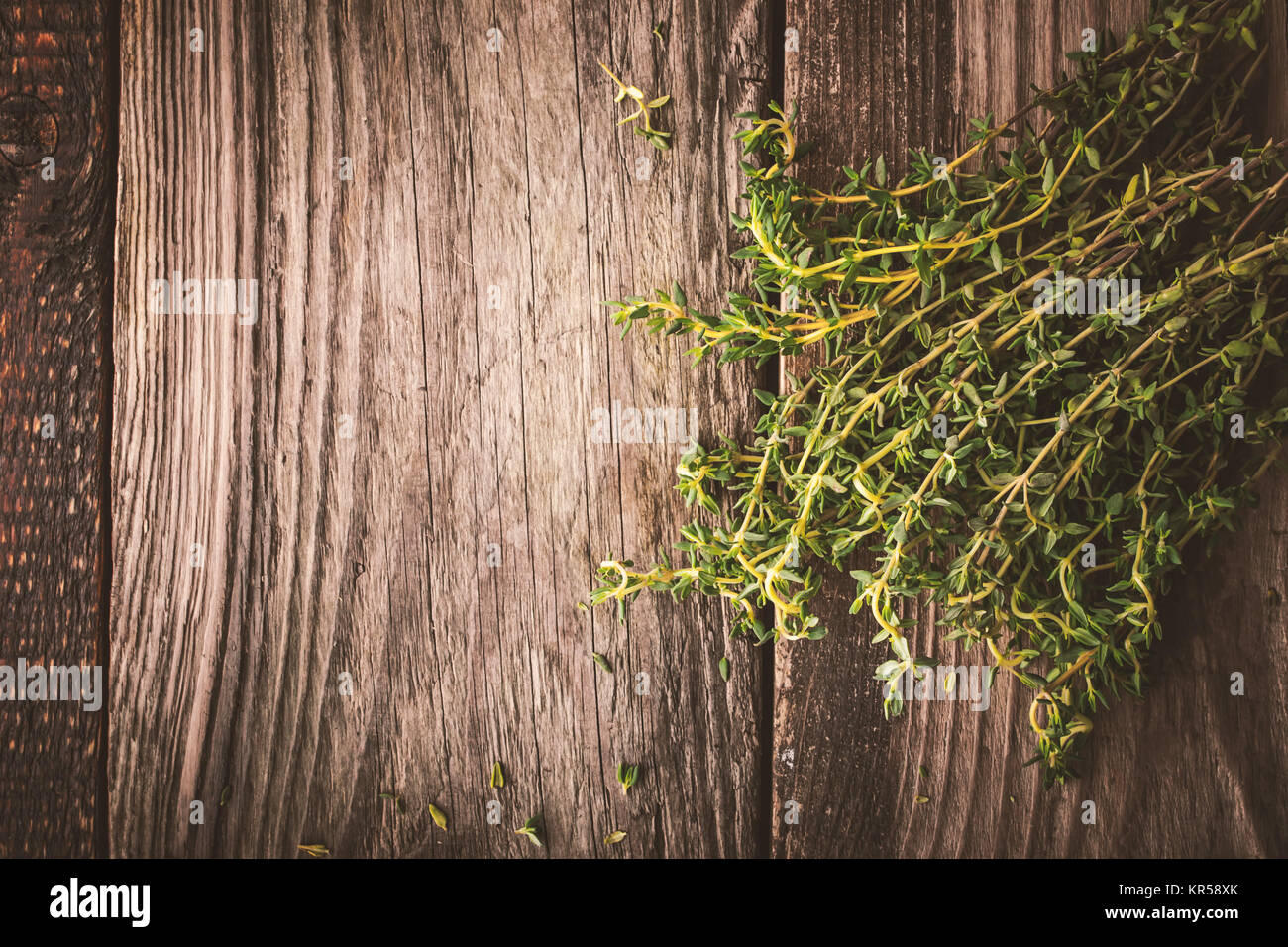 Bundle of thyme on the wooden board top view Stock Photo