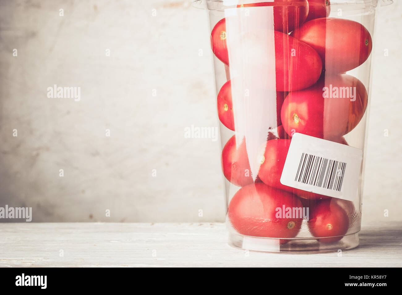 Tomatoes in the plastic container close-up Stock Photo