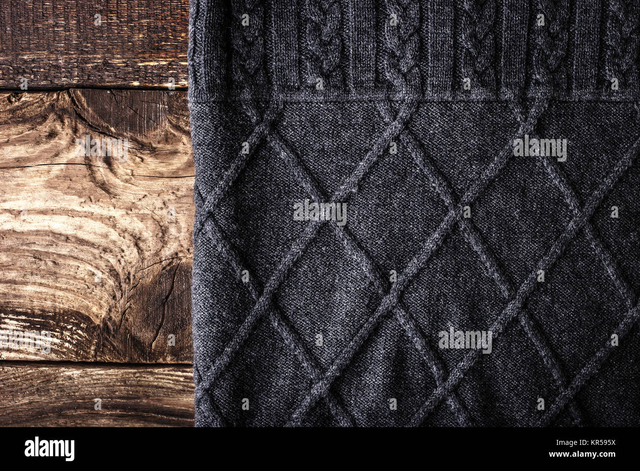 Grey figured sweater on the wooden background Stock Photo