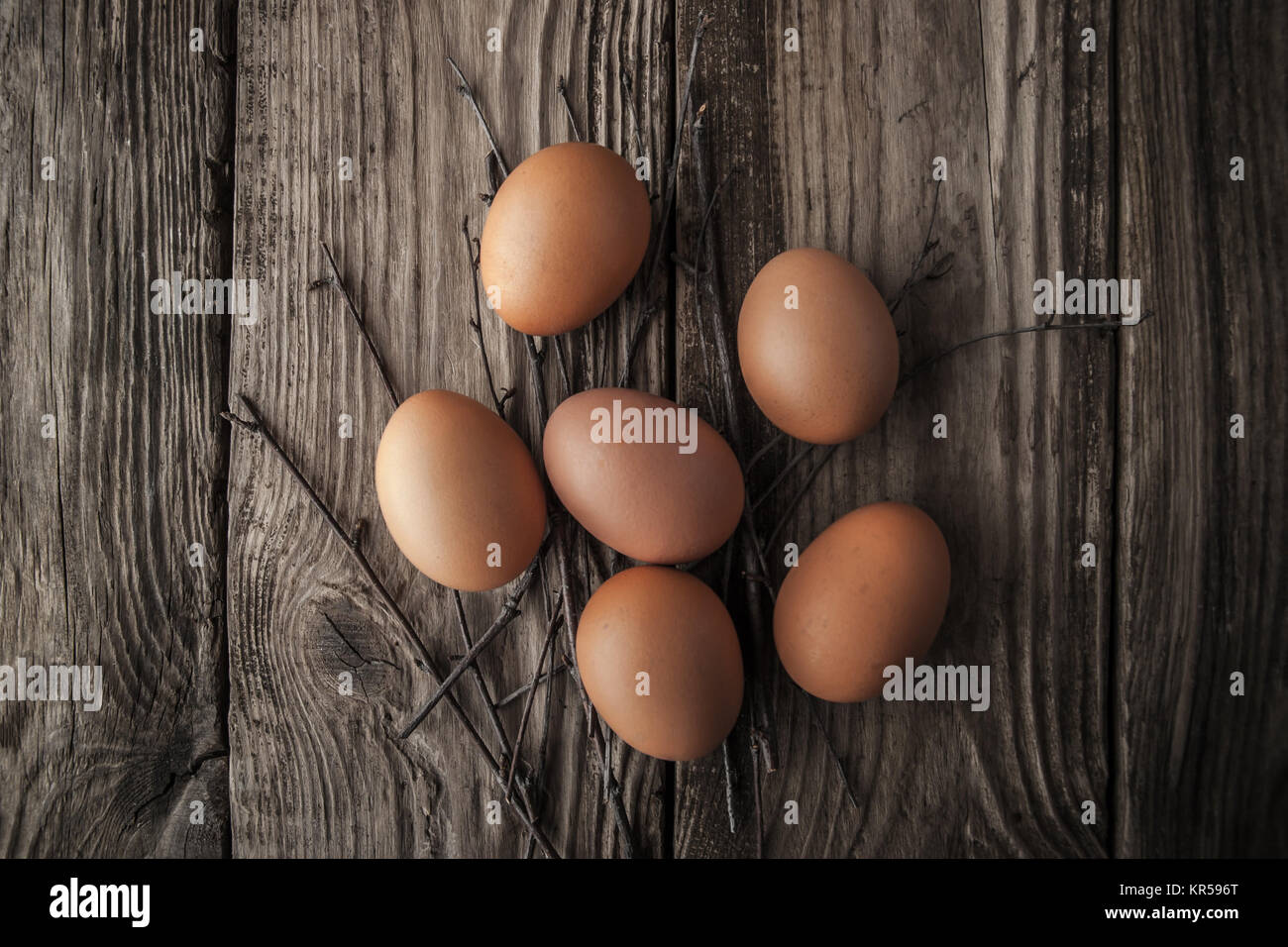 Chicken eggs on a wooden table Stock Photo