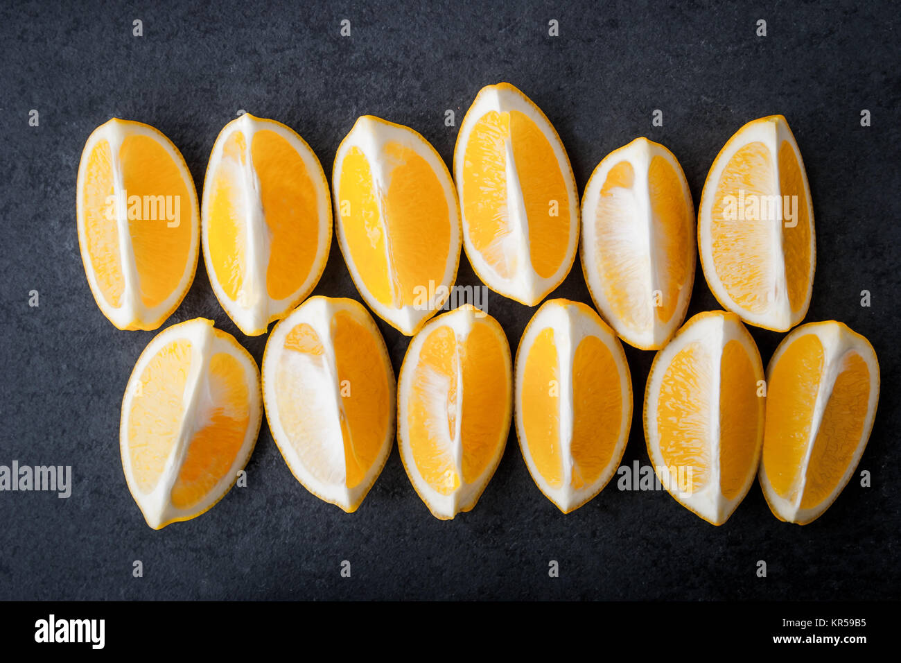 Yellow lemons on a blue stone table Stock Photo