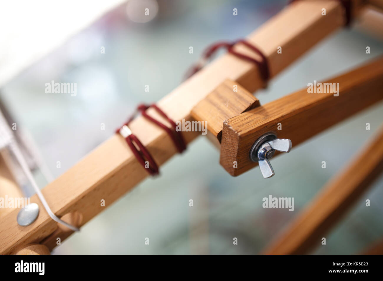 Adjustable solid wood cross stitch rack detail, close up photo. Stock Photo