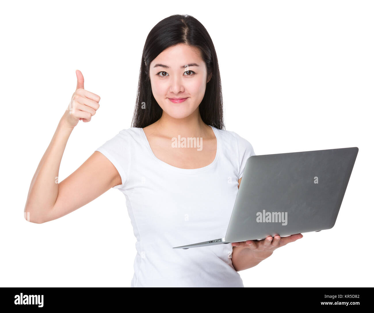 Young woman hold with laptop and thumb up Stock Photo - Alamy