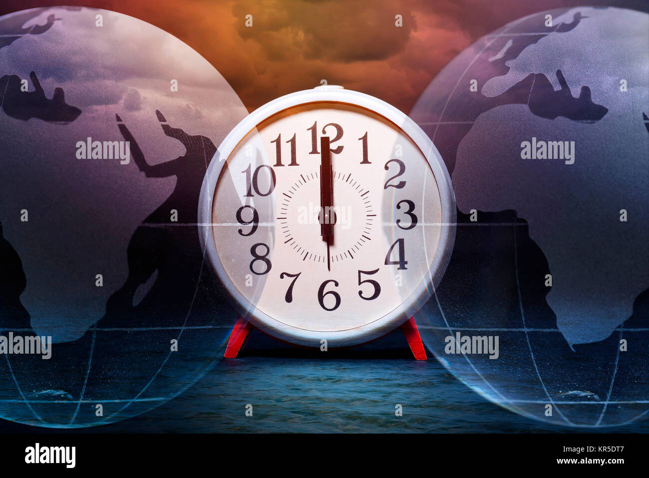 Alarm clock on 12 o'clock and globe, symbolic photo climate change, Wecker auf 12 Uhr und Erdkugel, Symbolfoto Klimawandel Stock Photo