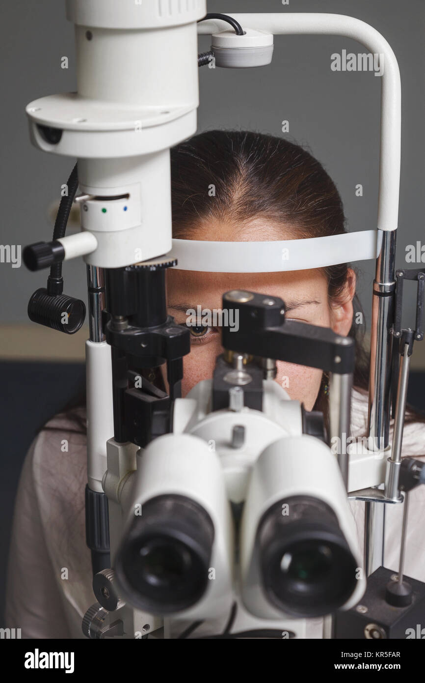 Beautiful young woman having eye test at the optometrist Stock Photo