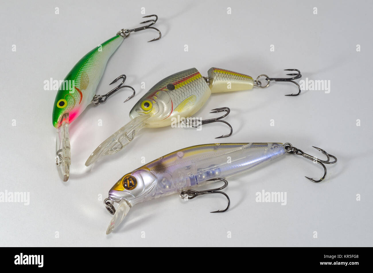 Different lures for fishing in the sand. Wobblers for catching predatory  fish. Hard lures in the sand Stock Photo - Alamy