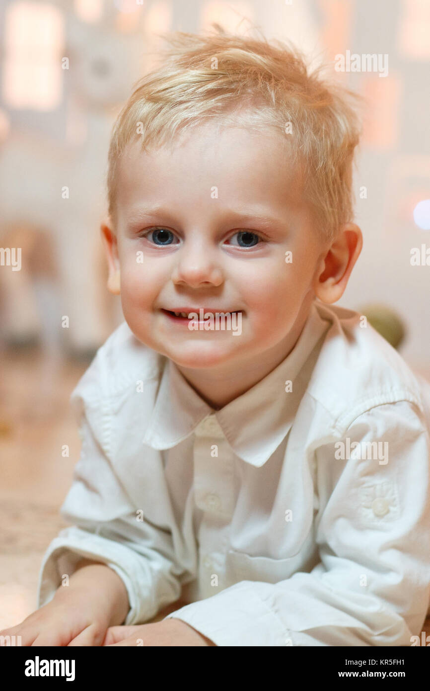 Cute Blonde Hair Little Boy Near Christmas Toy Paper Houses Stock