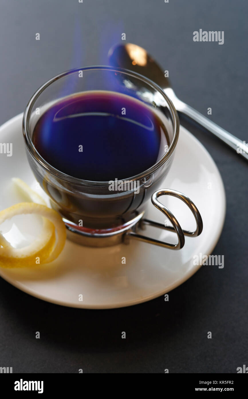 An image of a Carajillo Spanish drink combining coffee with brandy or rum. Set aflame to heat