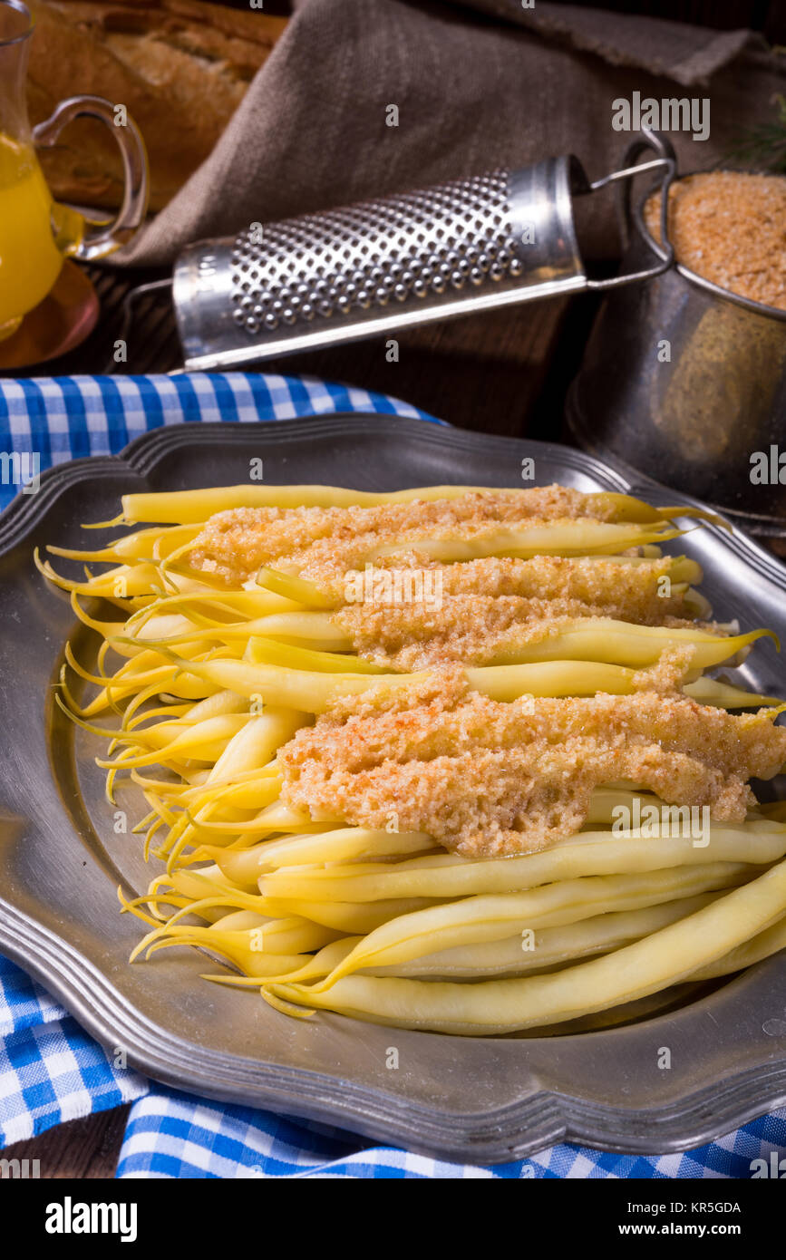 yellow string bean with bread crumbs Stock Photo Alamy