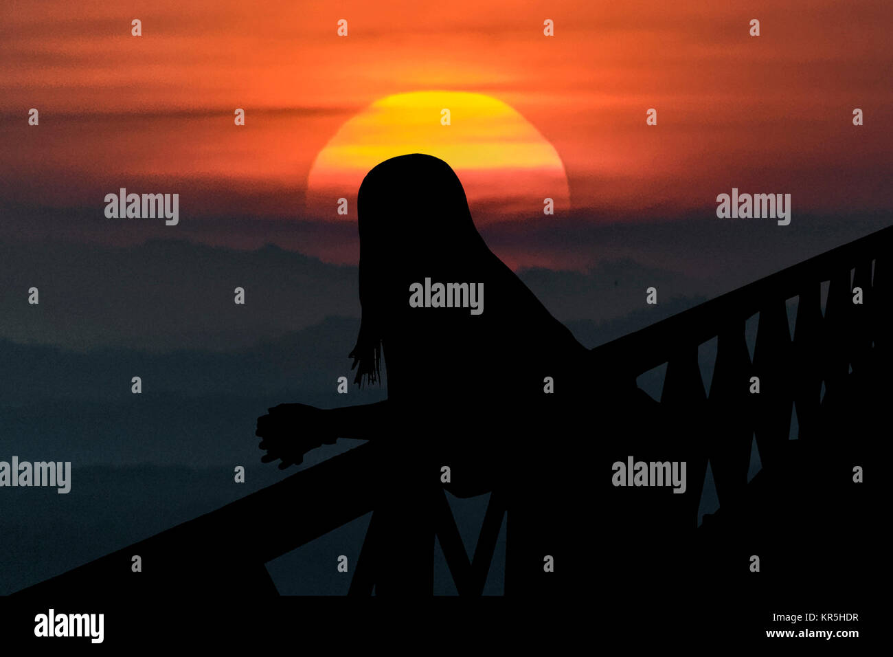Woman Silhouette on Bridge Stock Photo - Alamy