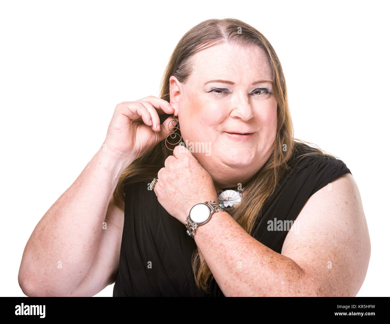 Closeup of Transgender Woman Adjusting and Earring Stock Photo