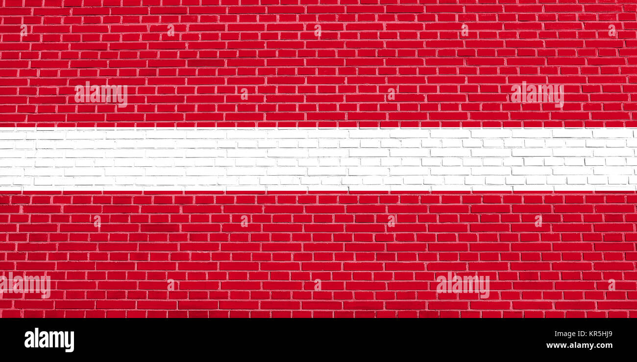 Flag of Latvia on brick wall texture background Stock Photo - Alamy