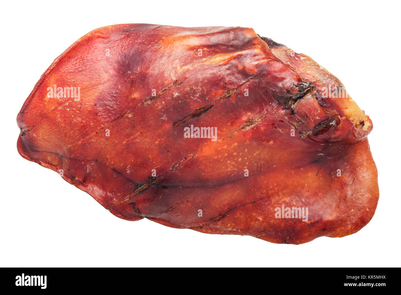 A real pigs ear used for dog treats on a white background Stock Photo