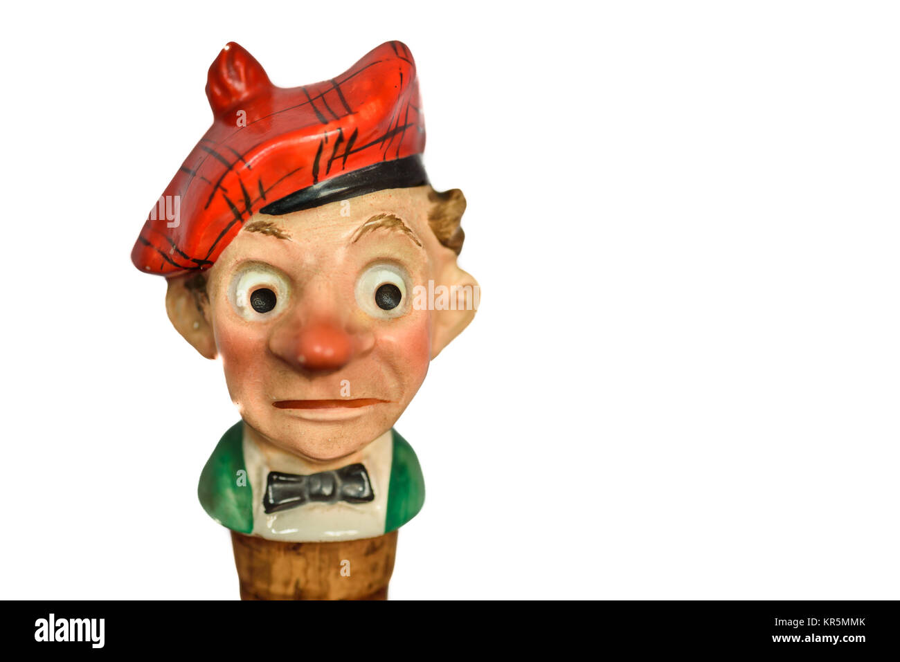 An old cork bottle stopper in the form of a comic caricature of red nosed scotsman. Stock Photo