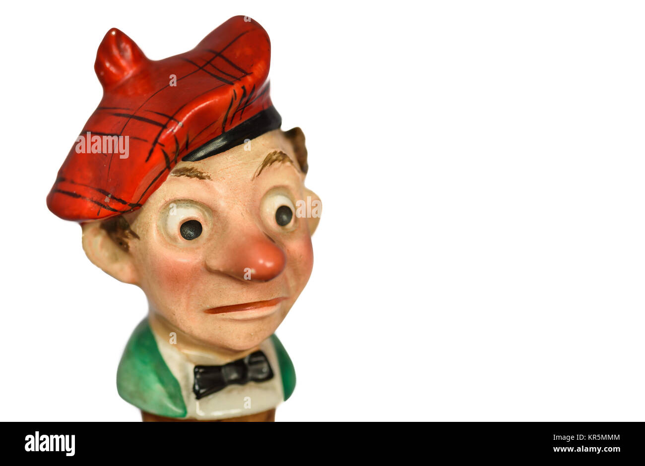 An old cork bottle stopper in the form of a comic caricature of red nosed scotsman. Stock Photo