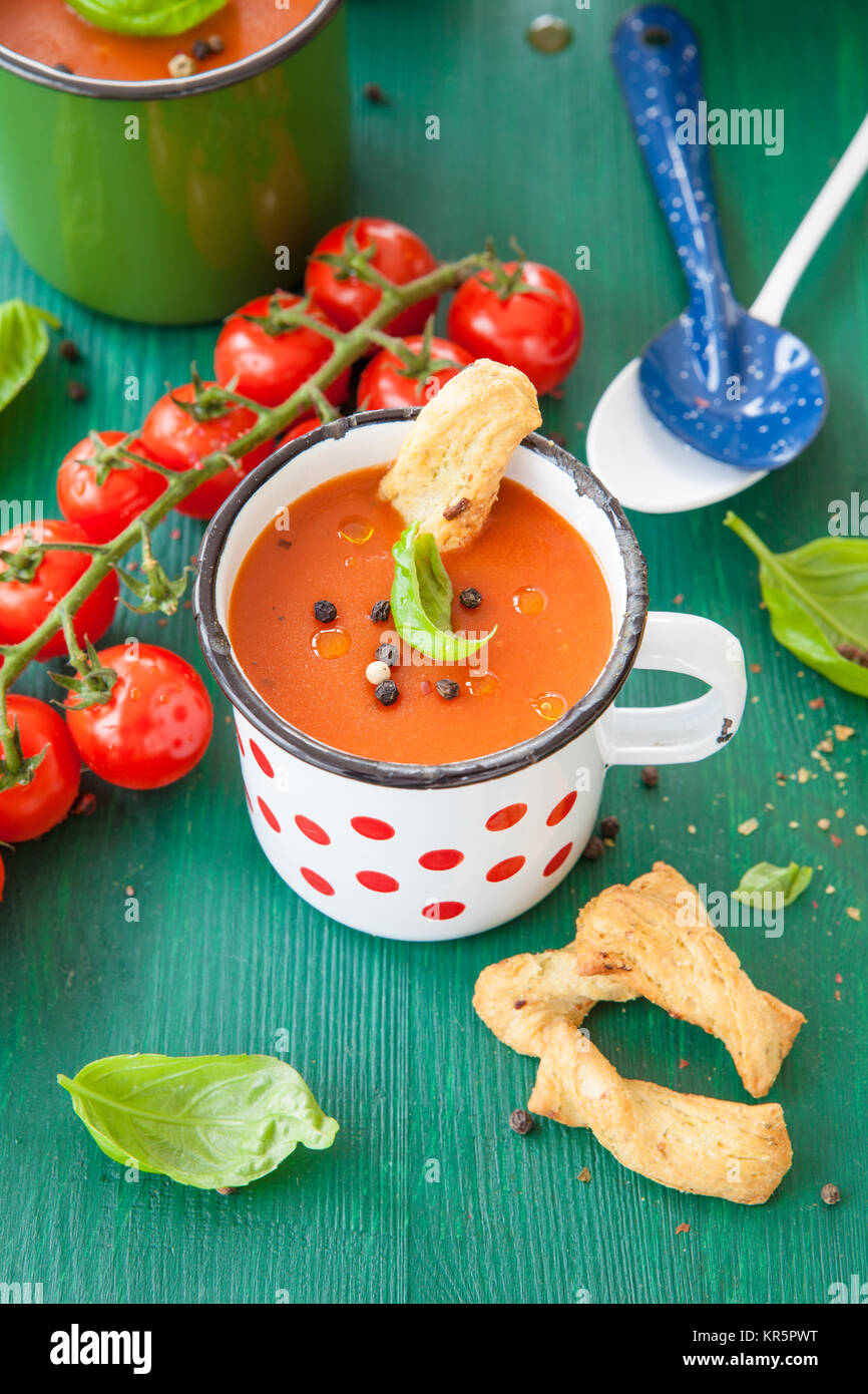 tomato soup in a rustic cup Stock Photo