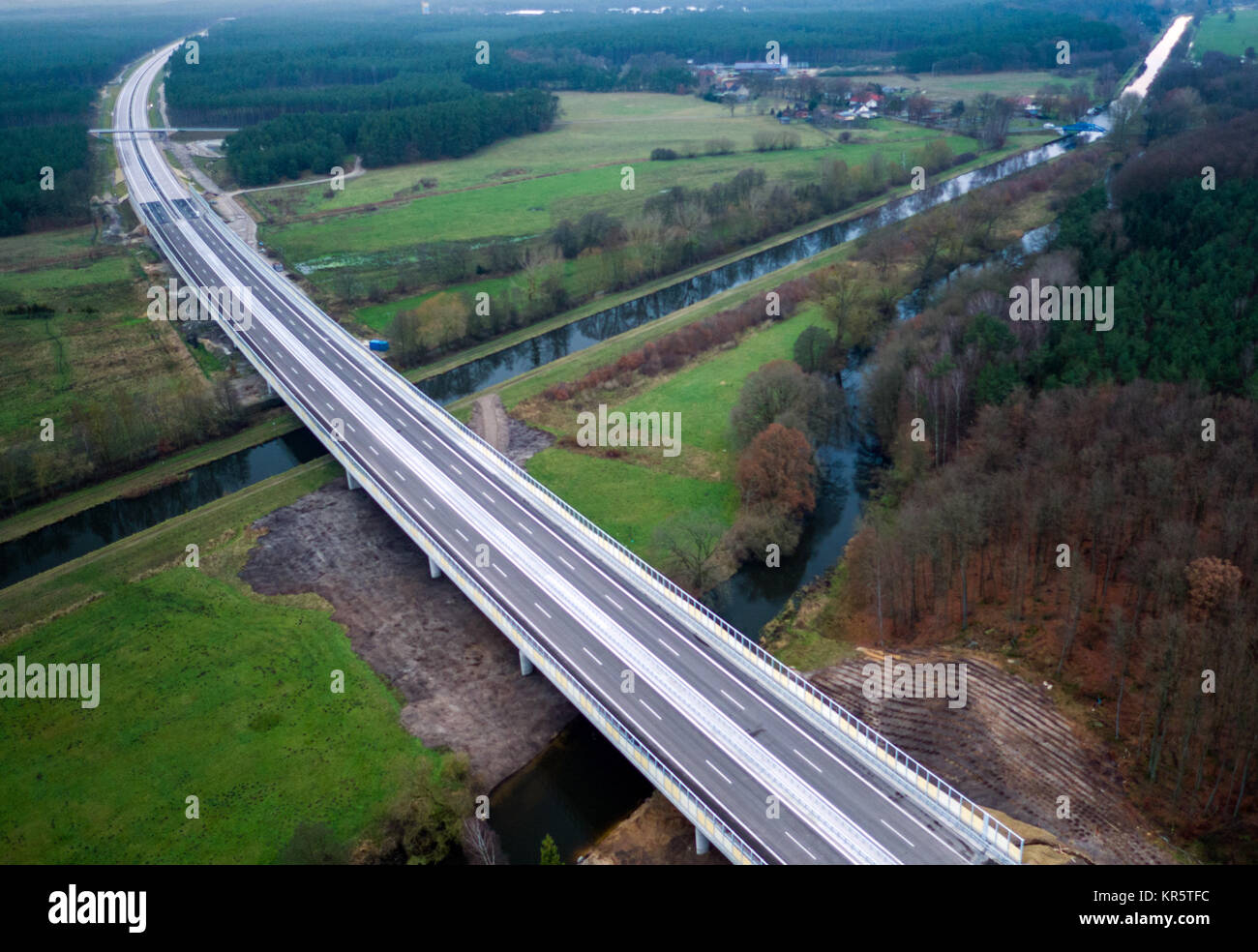 The finished, brand new A14 motorway bridge, crossing the river Elde is photographed with a drone near Grabow, Germany, 16 December 2017. The Eldetal Bridge is one of the longest with a length of 506, 5 metres between Groß Warnow and Grabow. The section will be officially opened on the 20th of December 2017. The 155 kilomtre line between Schwerin and Magdeburg cost approximately 1, 3 billion Euros and should be completed by 2020. Photo: Jens Büttner/dpa-Zentralbild/dpa Stock Photo