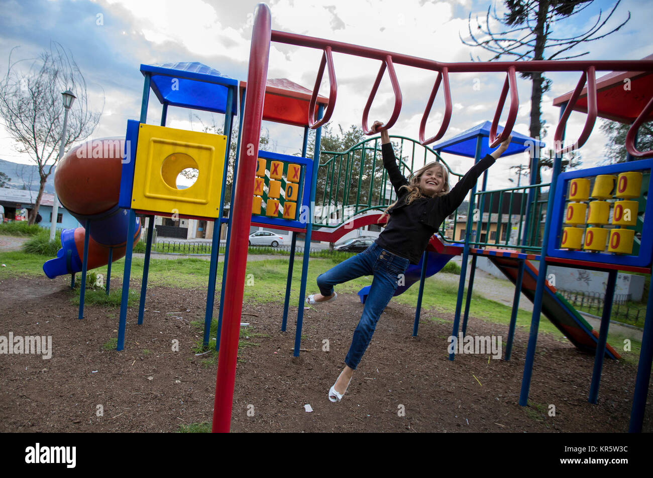 (171218) -- QUITO, Dec. 18, 2017 (Xinhua) -- Image taken on Dec. 15, 2017 shows Nathaly Ferreira Duarte playing in a park near her home in Quito, capital of Ecuador. Nathaly Ferreira Duarte and her mother Muriel Tugne Ferreira came to Ecuador from Brazil two years ago because of the economic crisis. Muriel works now as a manager at a store that sells movies and provides technical service for smartphones. The General Assembly of the United Nations proclaimed December 18 as International Migrants Day on Dec. 4, 2000. (Xinhua/Santiago Armas) (rtg) (ah)(yy) Stock Photo