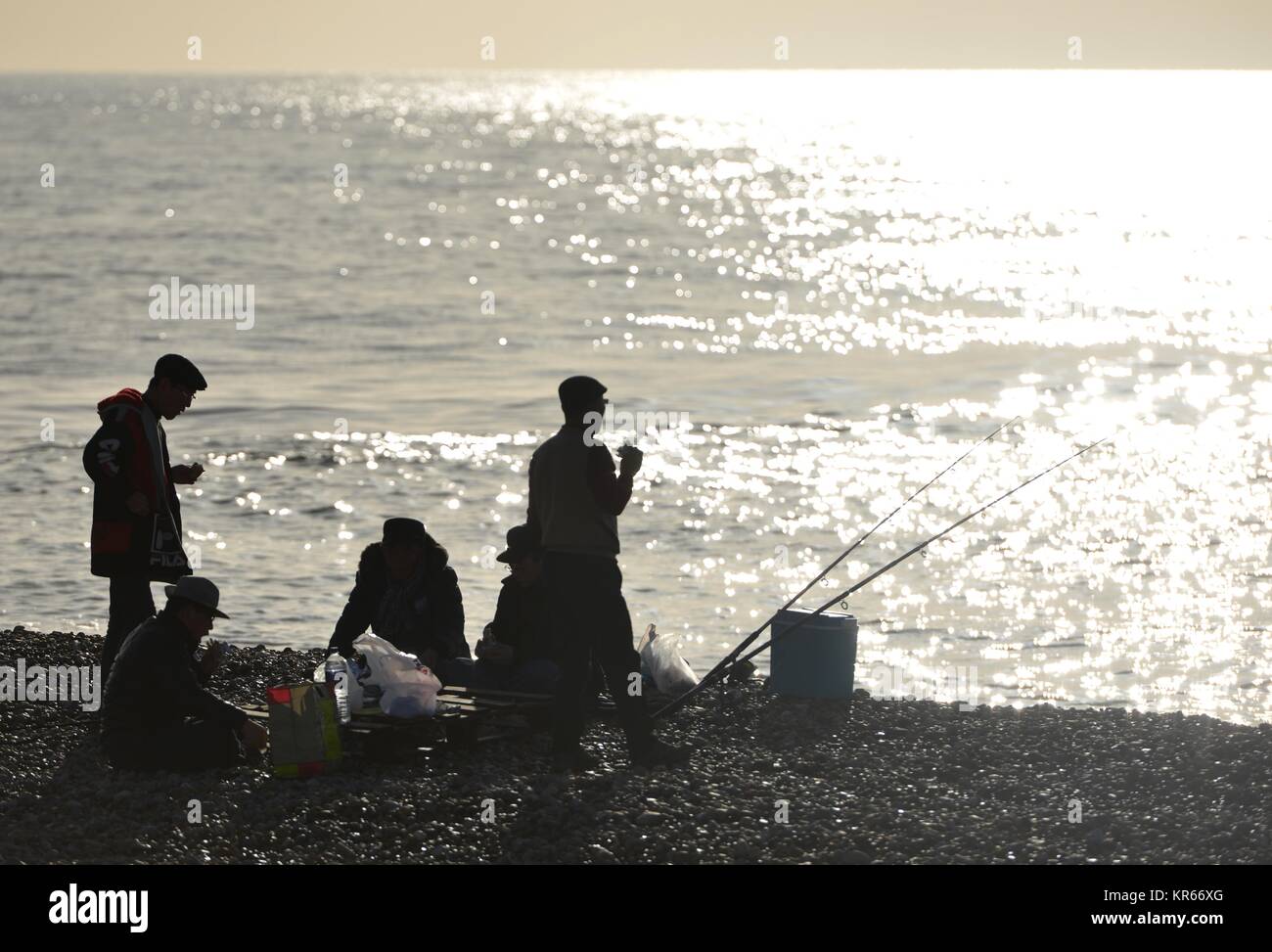 Seaford, East Sussex, UK. 19th Dec, 2017. People enjoying bright winter sunshine on Seaford beach, Eas Sussex. Credit: Peter Cripps/Alamy Live News Stock Photo