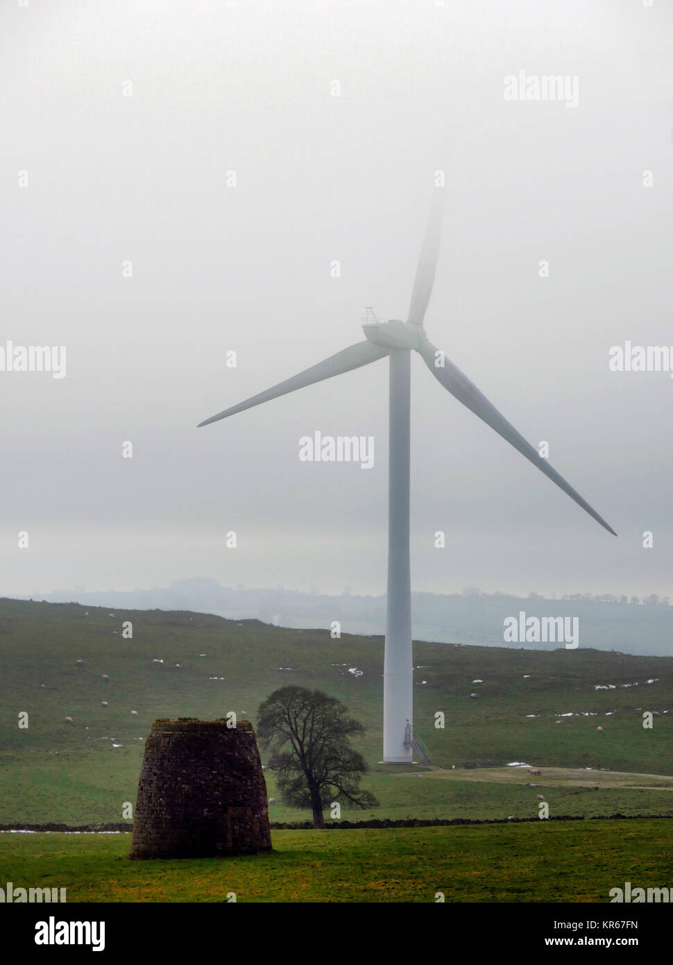 Brassington, Derbyshire. 19th December, 2017. UK Weather wind turbines turning in the cold mist near Brassington, Harborough Rocks & the High Peak Trail, Derbyshire, Peak District National Park Credit: Doug Blane/Alamy Live News Stock Photo
