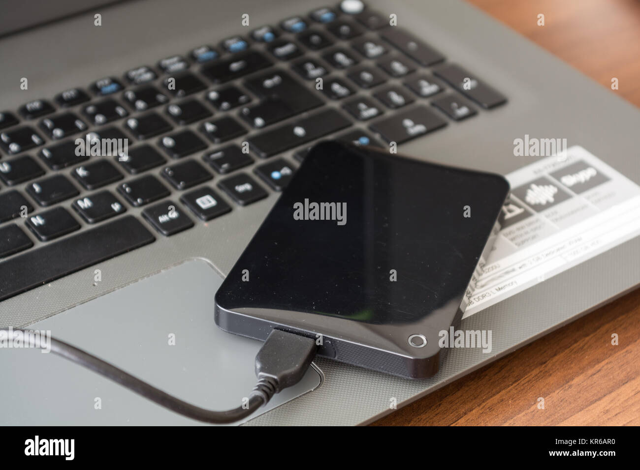 external hard drive and laptop - closeup Stock Photo