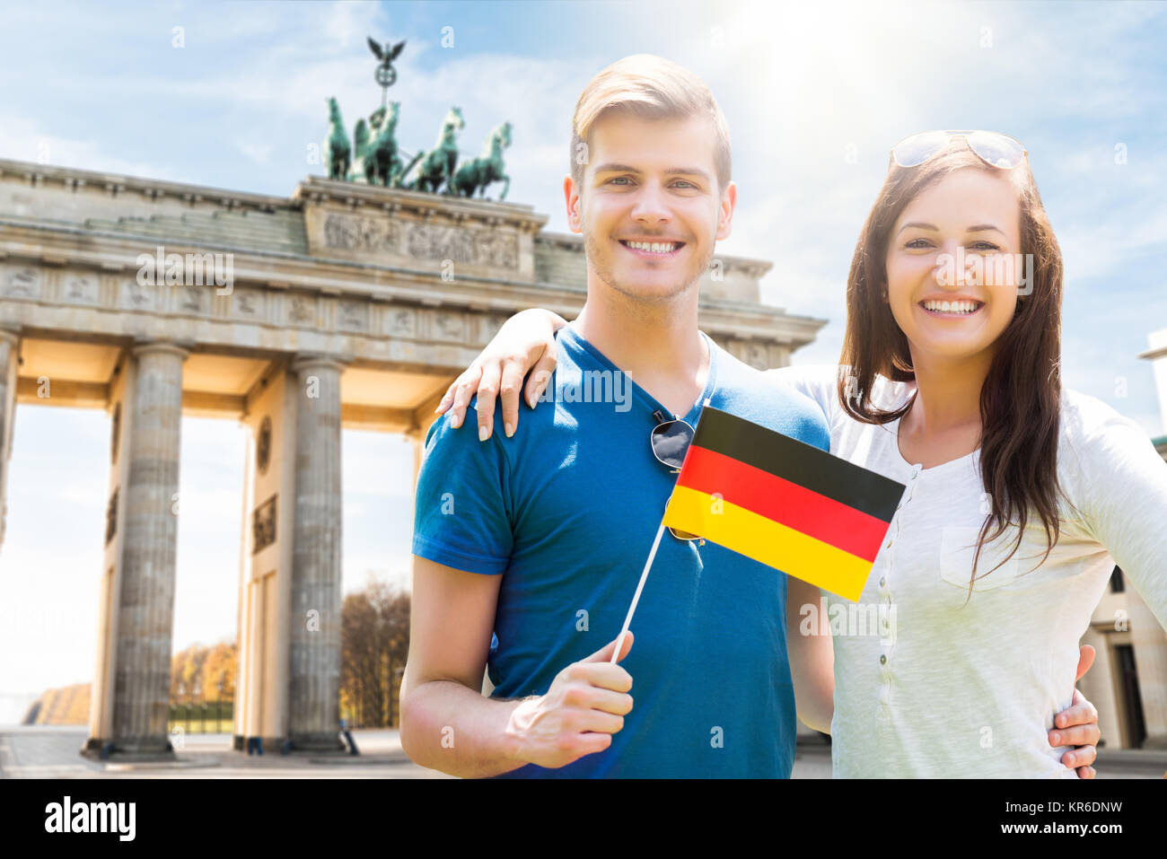 Smiling Couple Holding German Flag Stock Photo