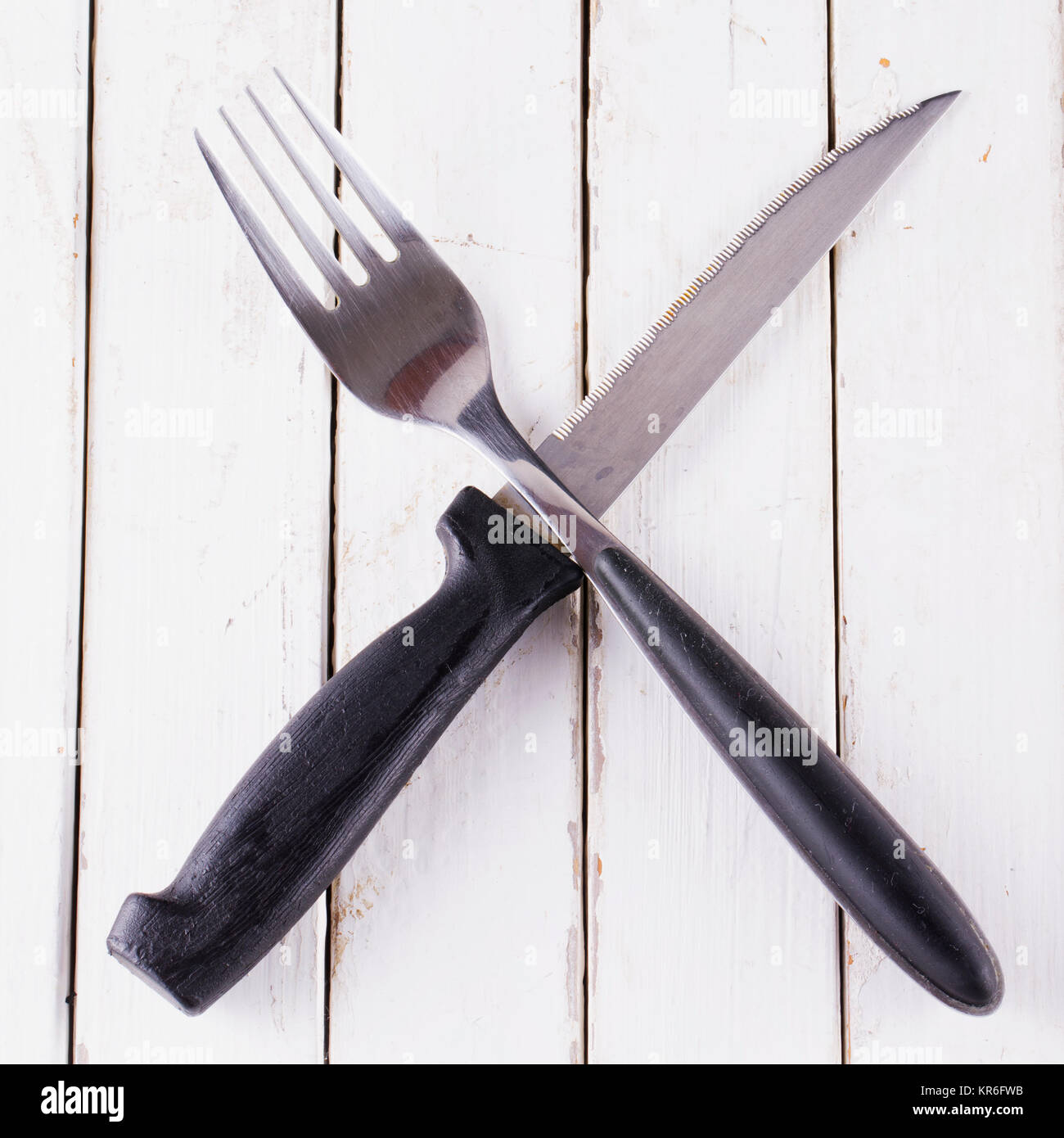 Black crossed cutlery Stock Photo Alamy