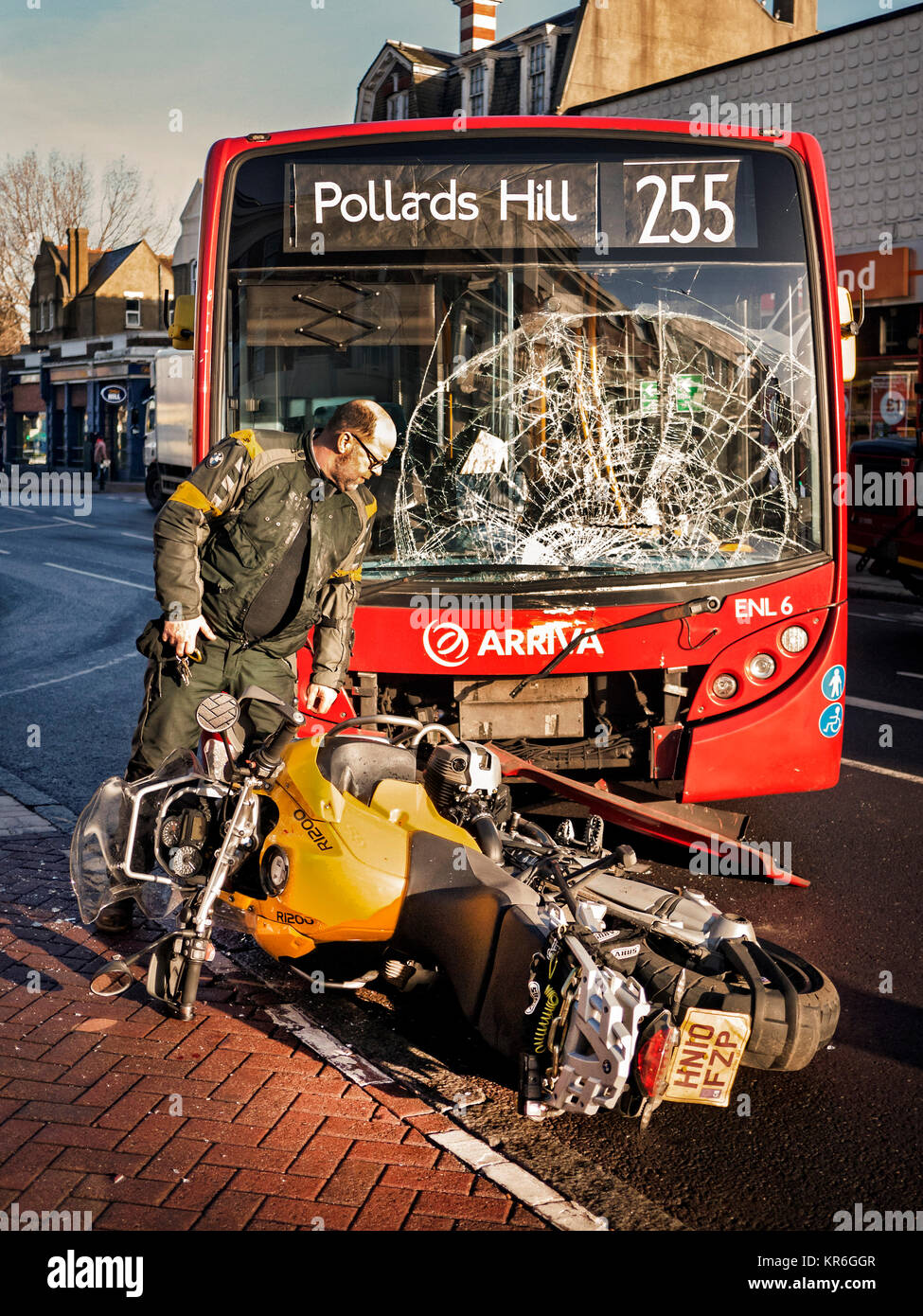 Road accident between a London bus and BMW motorcycle Stock Photo