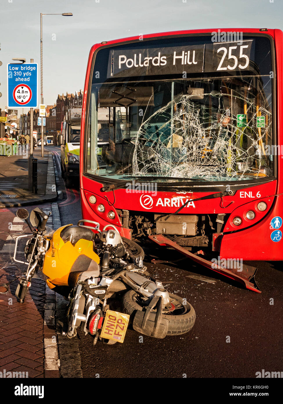 Road accident between a London bus and BMW motorcycle Stock Photo