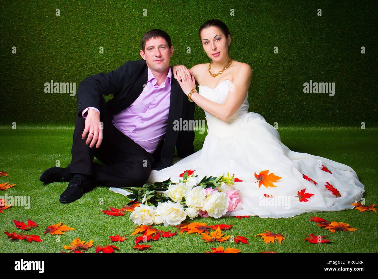 Bride and groom sitting together Stock Photo - Alamy